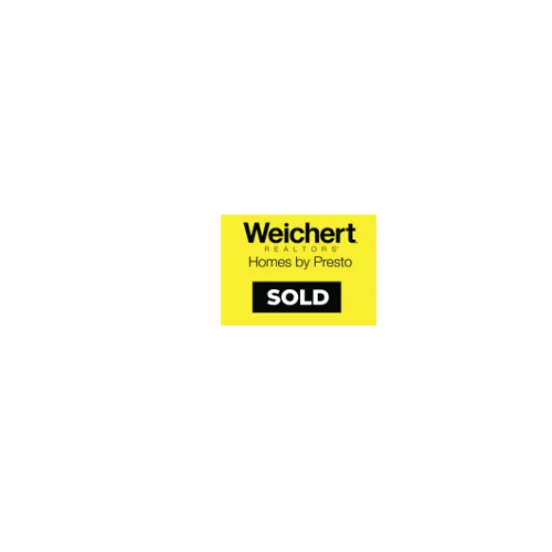A real estate sign with the logos of Weichert Realtors and Homes by Presto, and a black and white 'SOLD' banner.