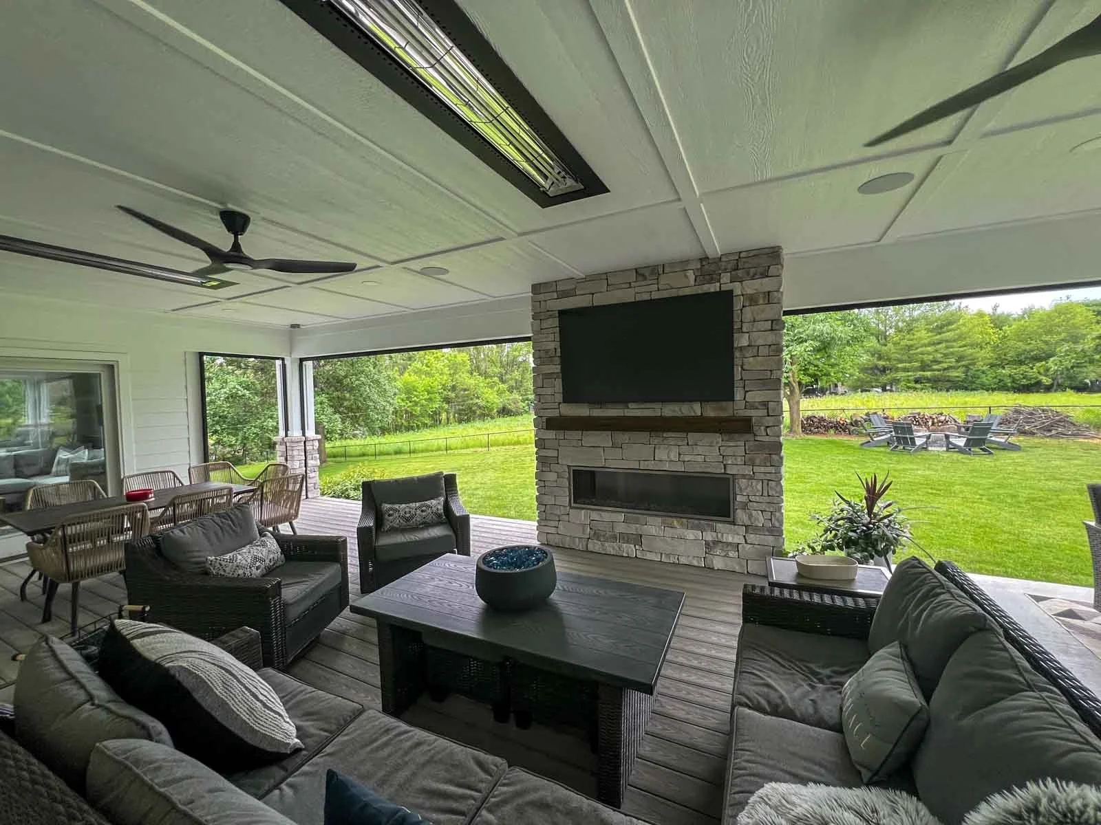 Covered patio with heaters and feature wall