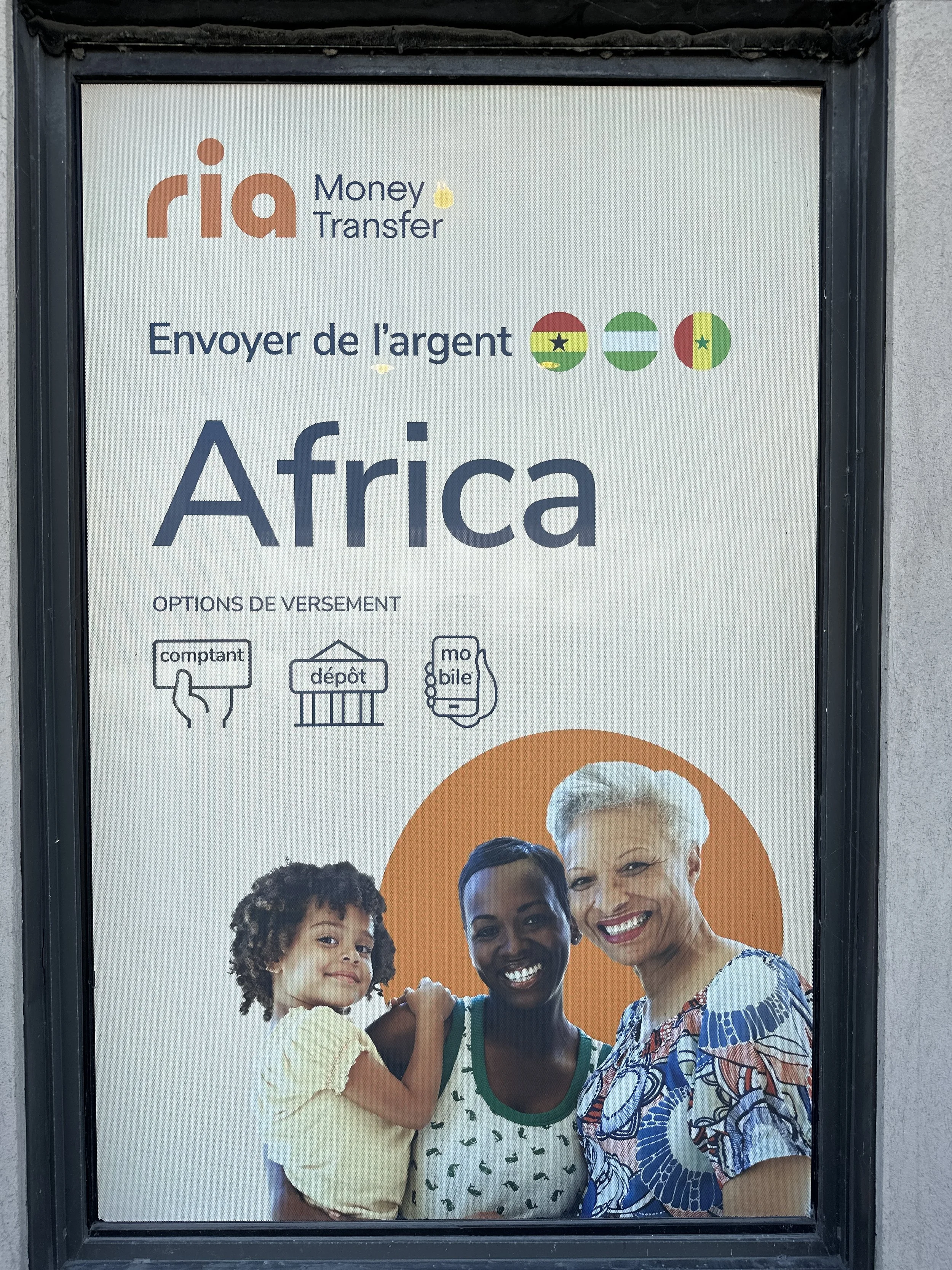 Poster advertising money transfer services to Africa, featuring the logos of Senegal, Nigeria, and Burkina Faso, with a photo of smiling women and a child.