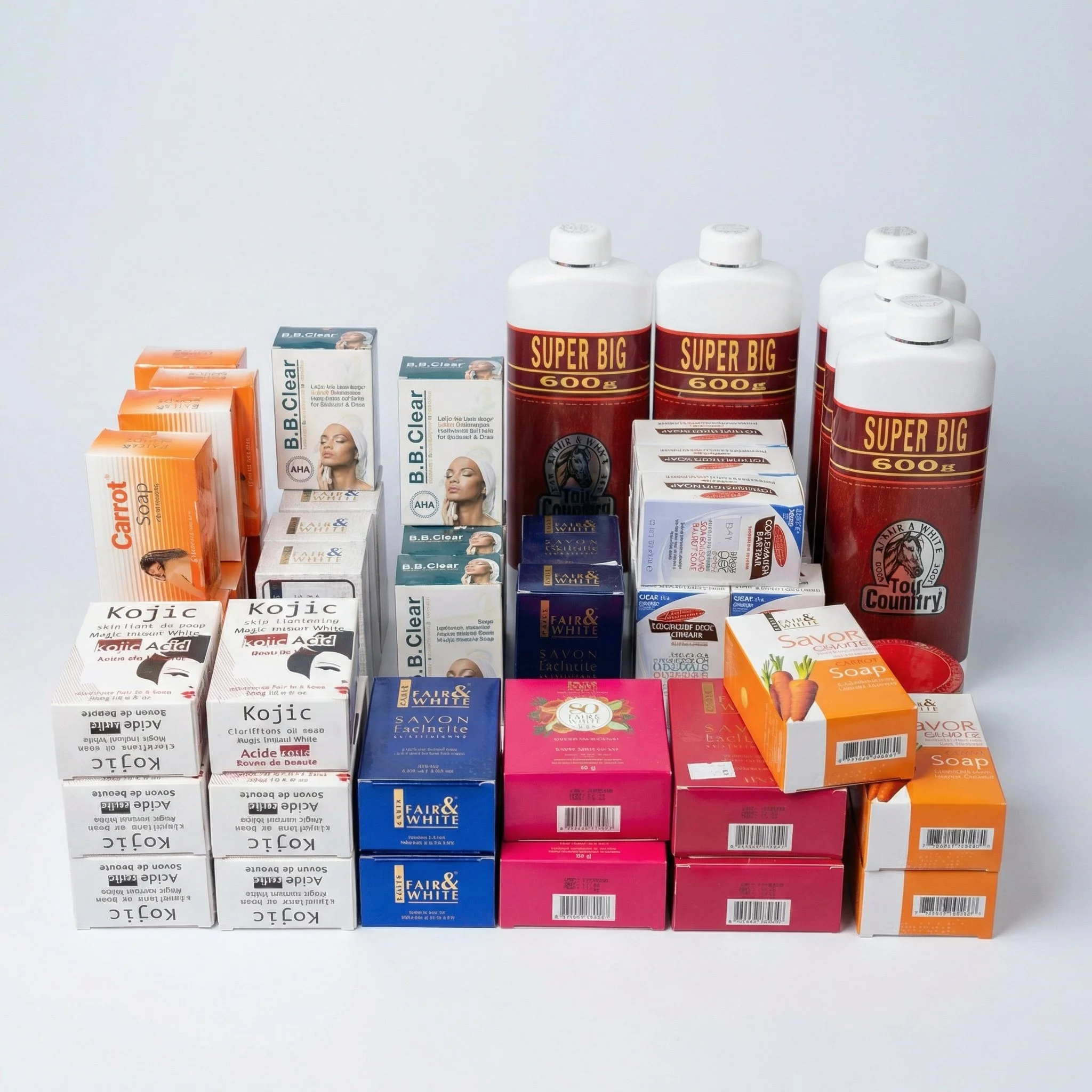 Assorted soap and personal care products arranged on a white surface, including orange, blue, pink, and white boxes and large red bottles labeled 'Super Big 600'.