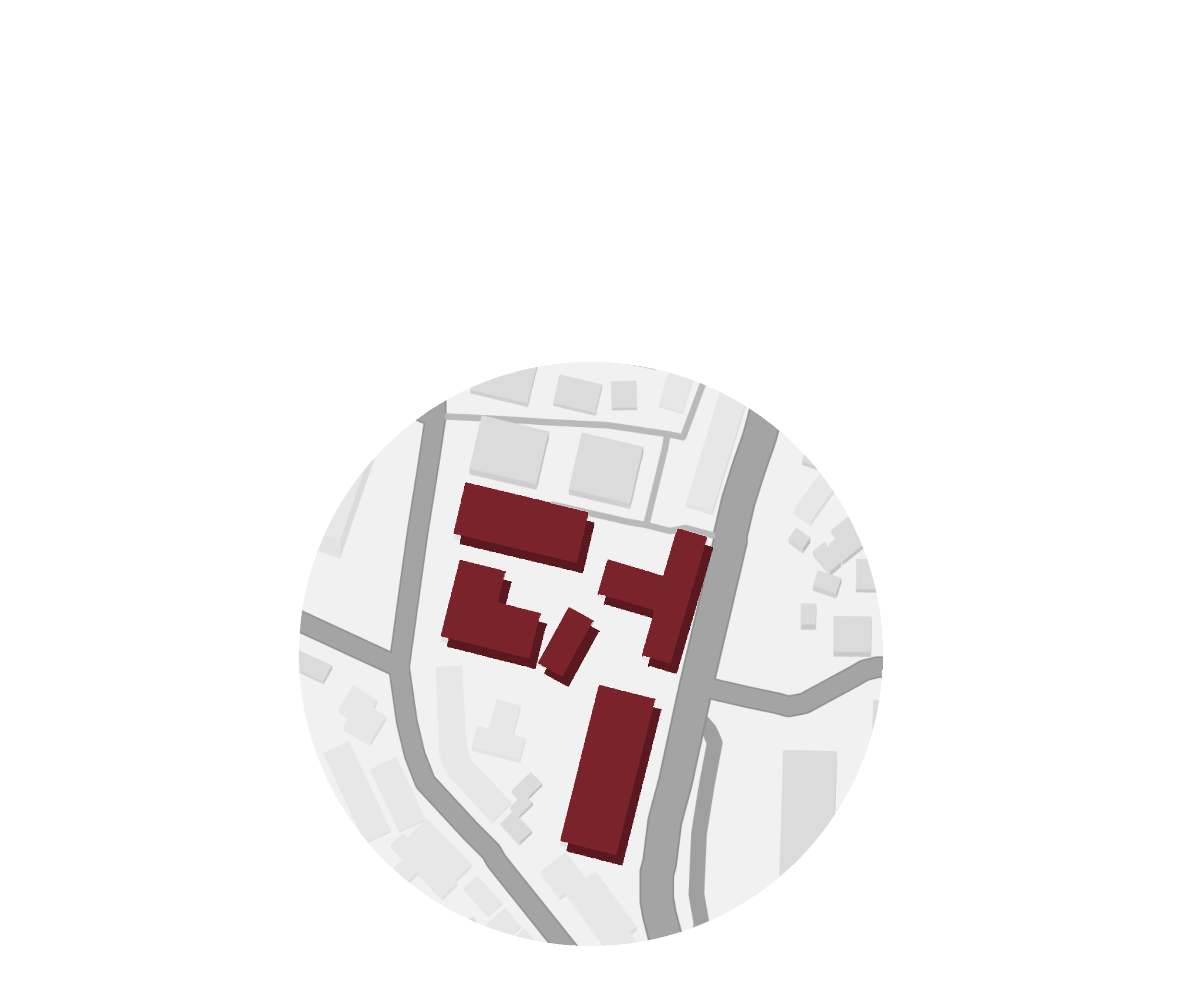 A map showing a small area with several buildings highlighted in brown, roads around the buildings, and other structures in light gray.