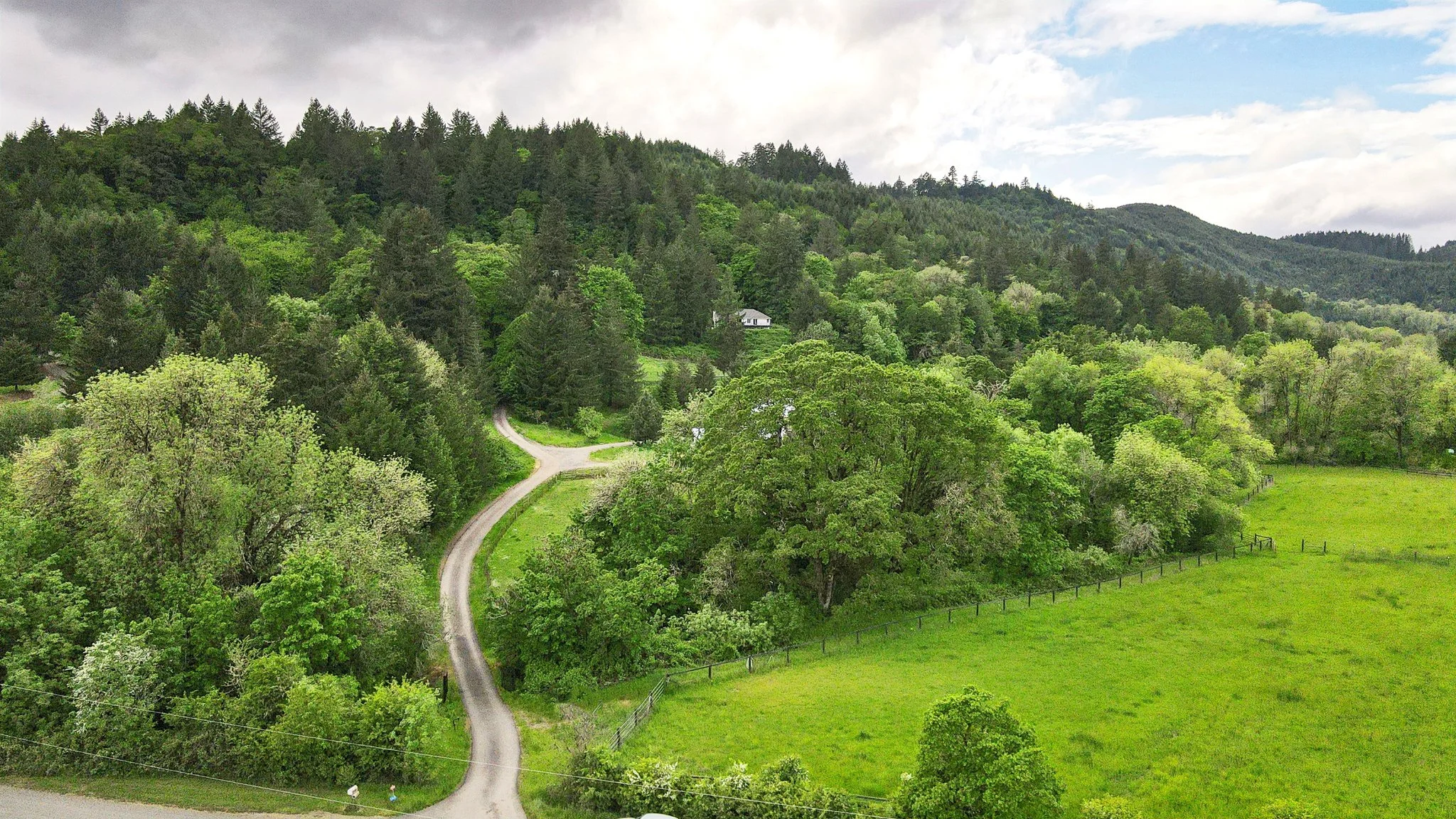 Aerial drone photography showing a residential property and surrounding landscape in Oregon