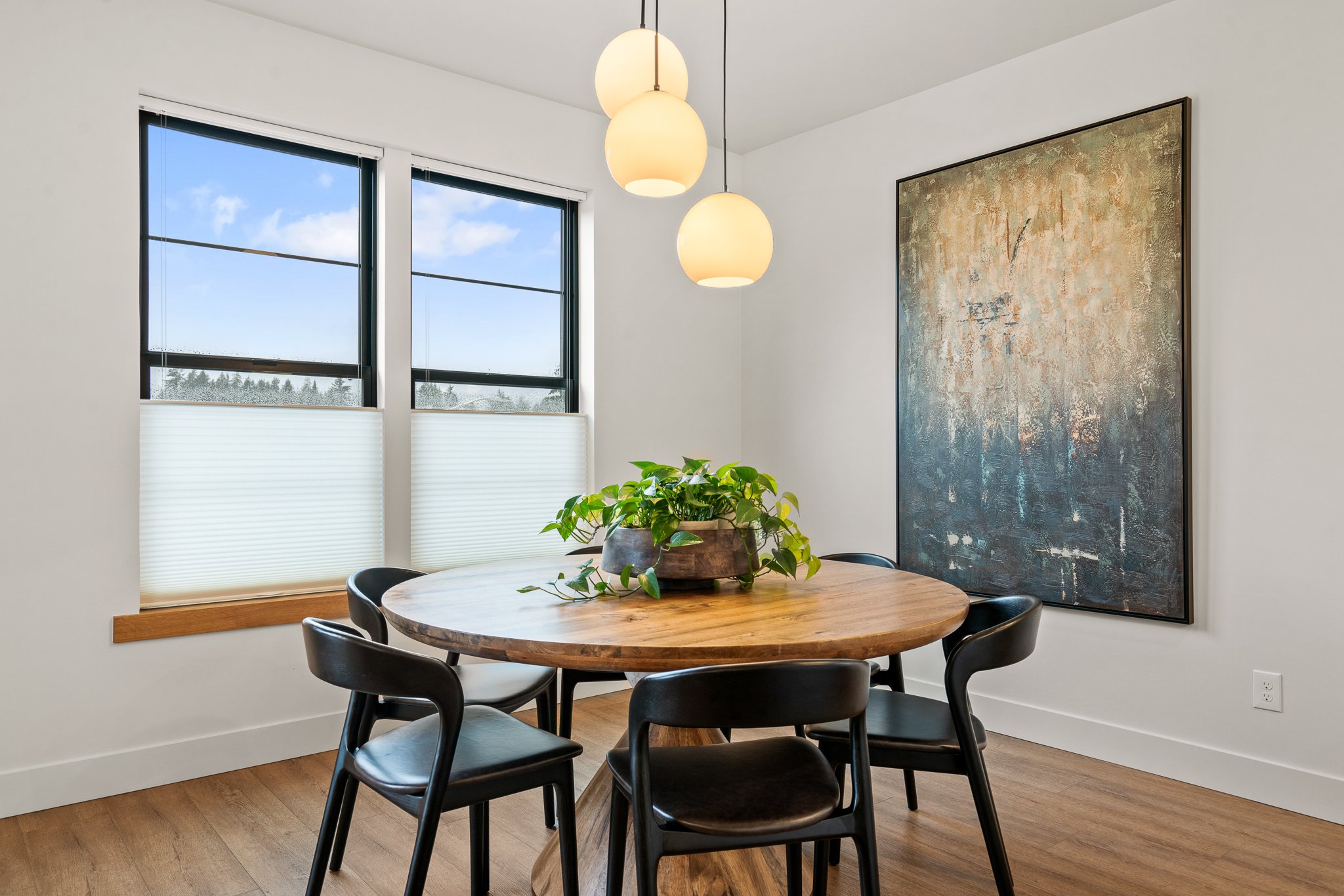 Professional real estate photography of a dining room showing room flow and natural lighting