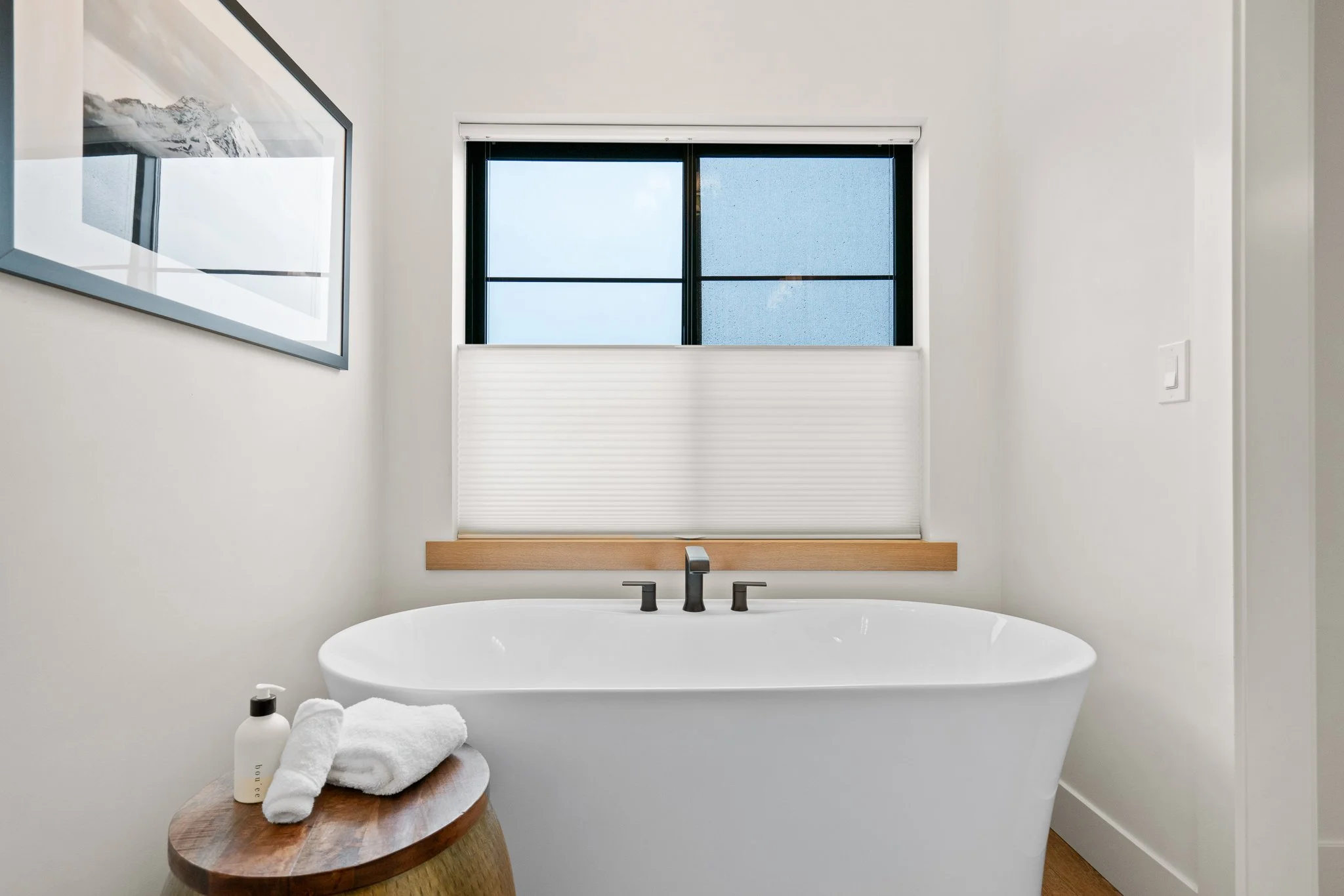 High-quality real estate photography of a modern bathroom with clean finishes and natural light