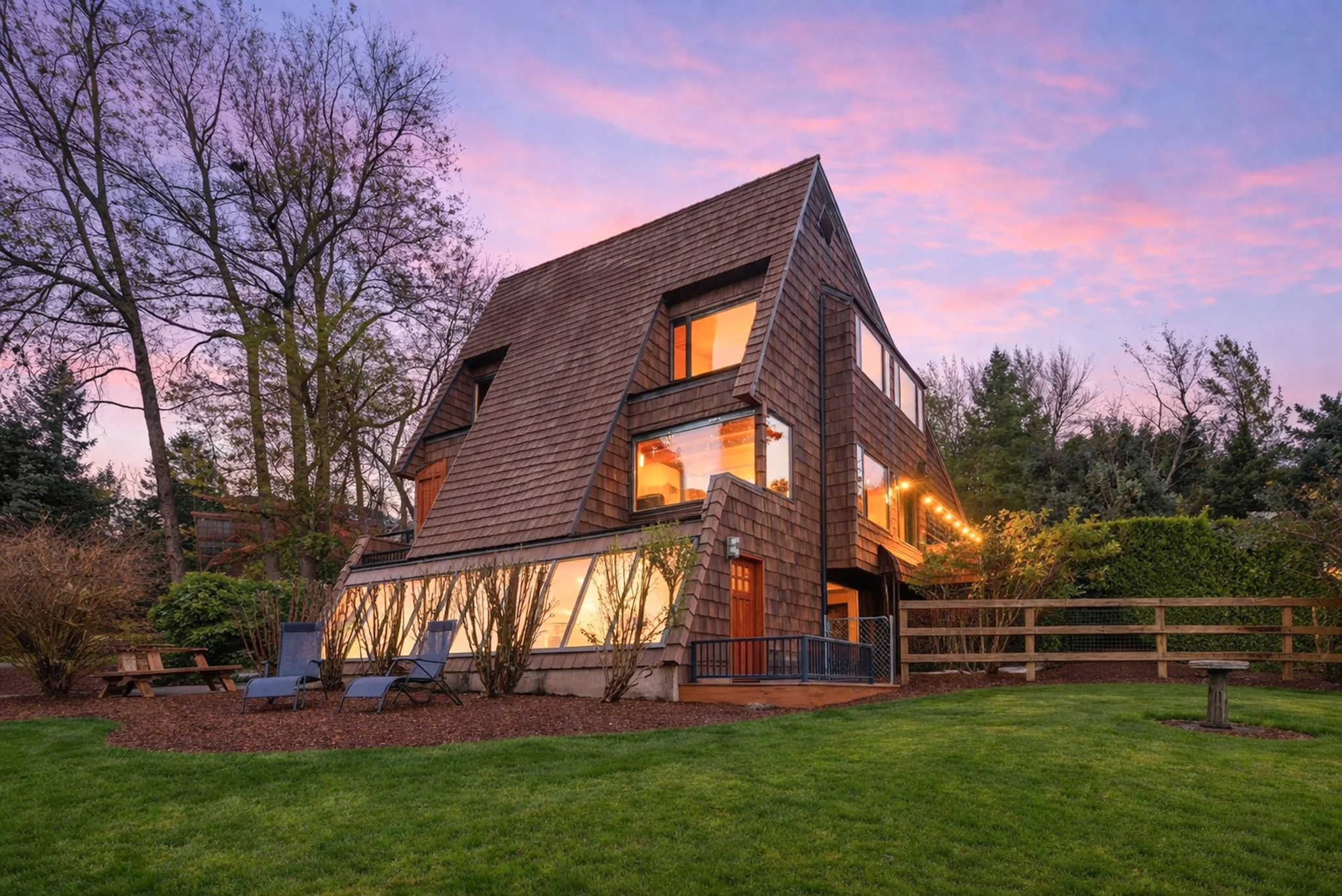 Twilight real estate photography of a home exterior with warm interior lights at dusk in Salem, Oregon