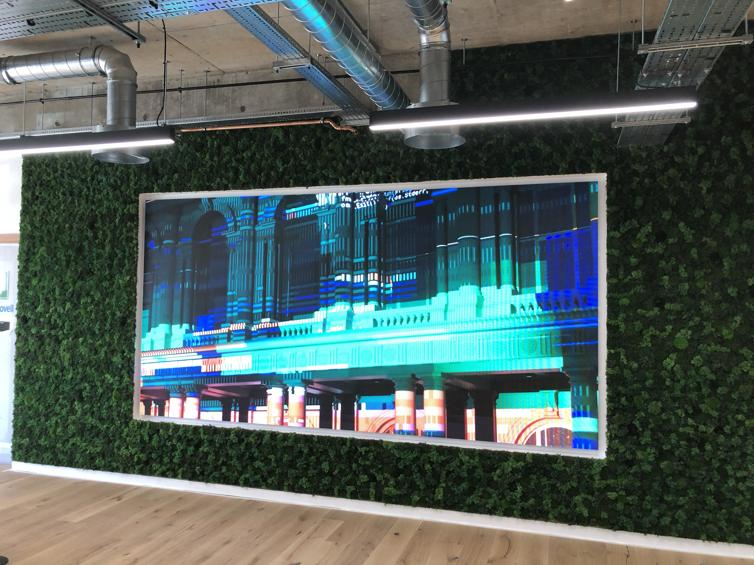 Digital artwork displaying a futuristic cityscape with tall buildings and bright neon lights in shades of blue and green, framed by a green leafy wall.