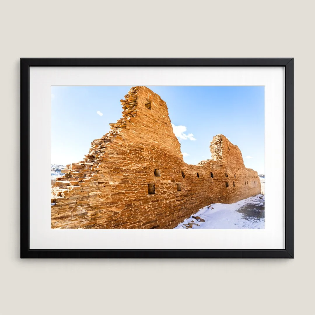 Framed Chaco Canyon wall art print with black frame and white mat, highlighting ancient desert architecture in New Mexico.