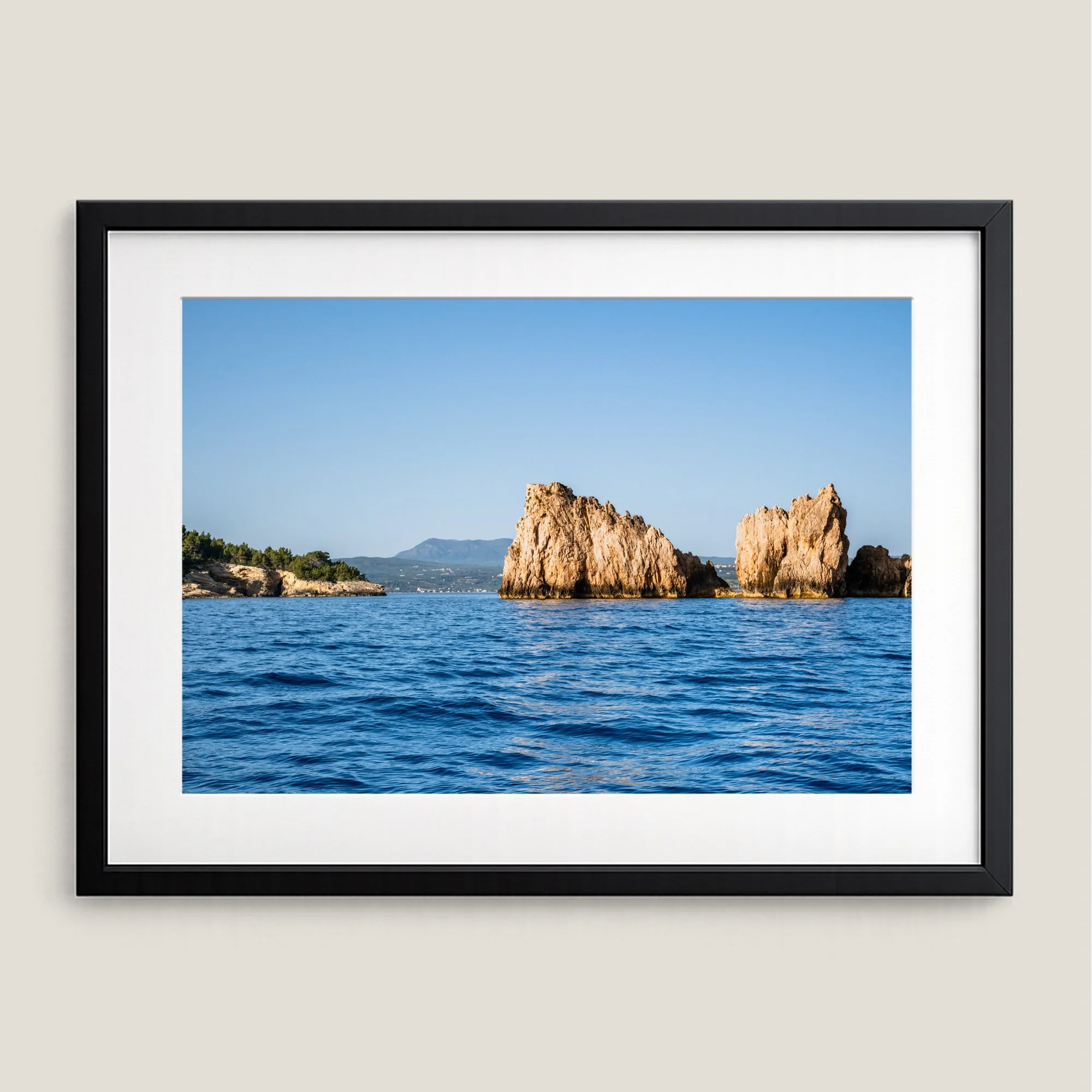 Framed ocean wall art of Navarino sea stacks in Messinia Greece with blue water