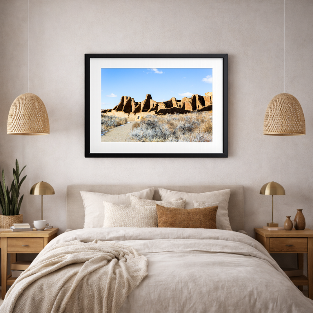 Chaco Canyon ruins fine art print displayed in a warm, earthy-toned bedroom interior.