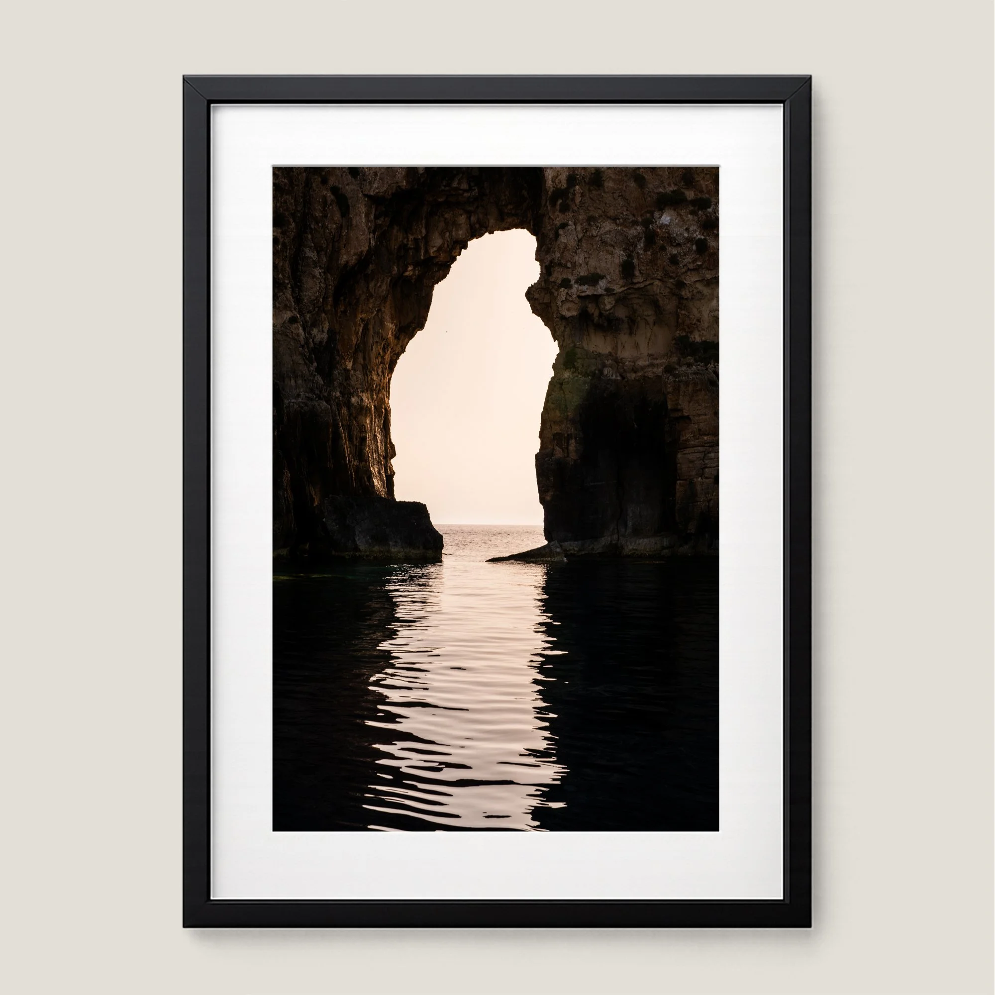 Framed coastal wall art of Navagio sea arch in Messinia Greece at sunset