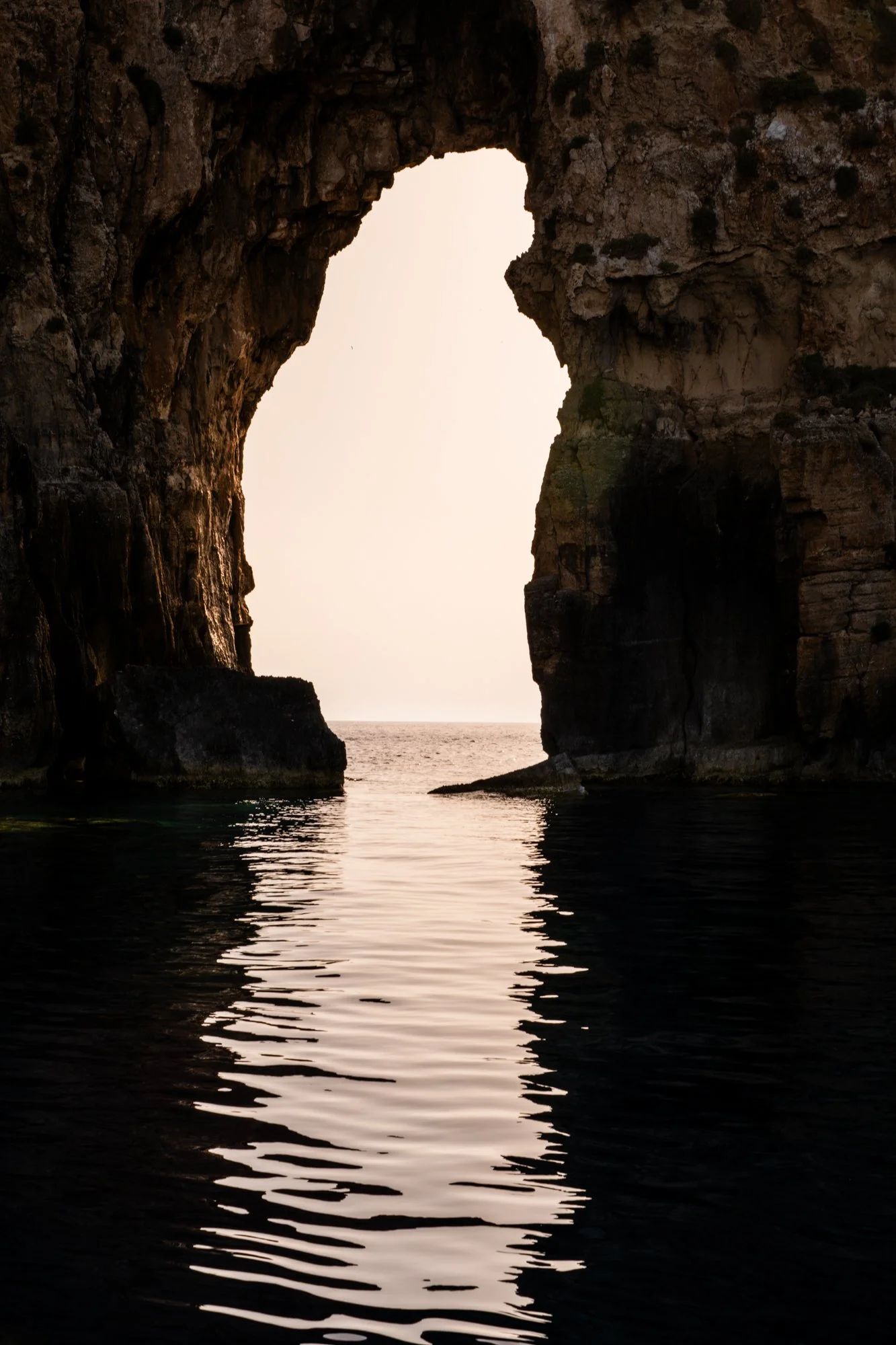Coastal photography wall art print of Navagio sea arch in Messinia Greece at sunset