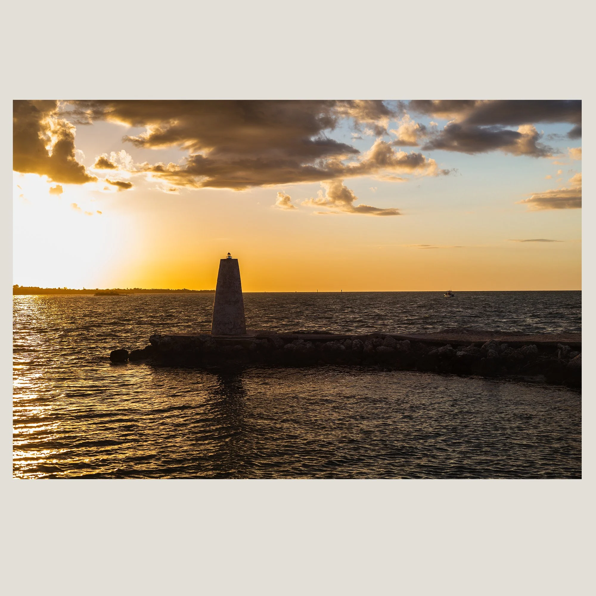 Florida Keys harbor marker illuminated by warm sunset light.
