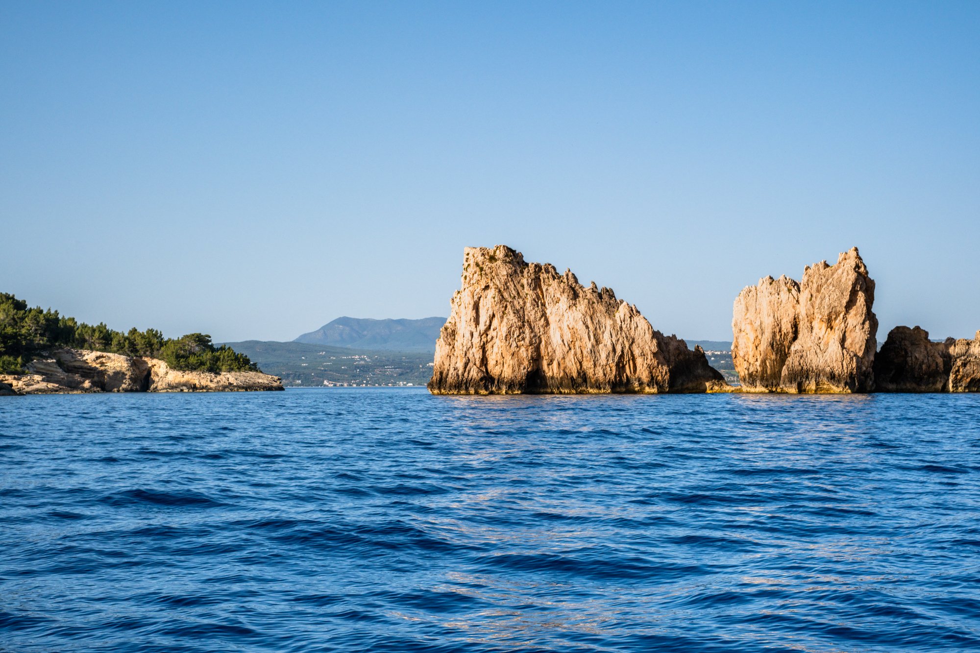 Fine art photography print of Navarino sea stacks in Messinia Greece with blue water