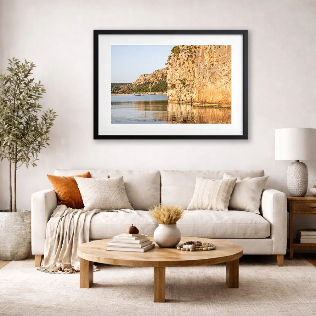Voidokilia beach coastal wall art displayed above sofa in neutral modern living room