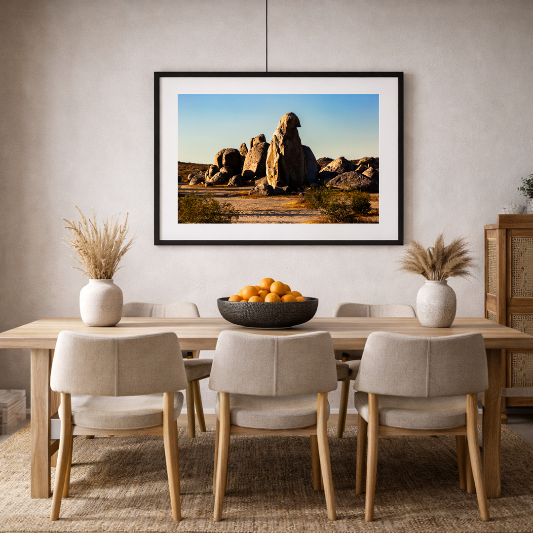 Southwest desert boulder formation fine art print displayed in a warm, contemporary living room interior.