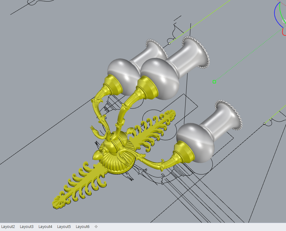 Computer-aided design rendering of a mechanical assembly with silver and yellow components, including three large silver funnel-shaped parts and a yellow decorative element with leaf-like shapes, on a gray background with measurement lines.