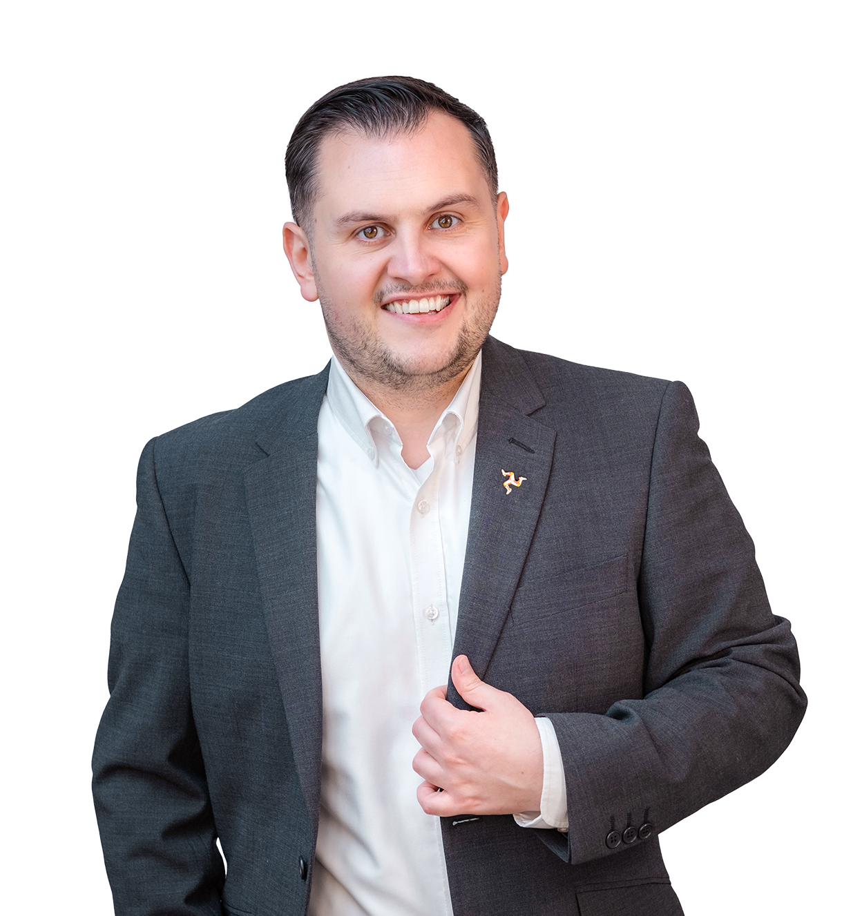 Portrait of a smiling man in a dark suit and white shirt, with short dark hair, against a black background.