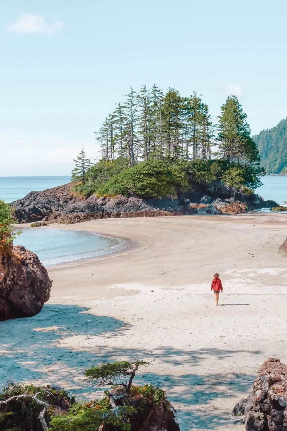 A woman walking on a westcoast beach