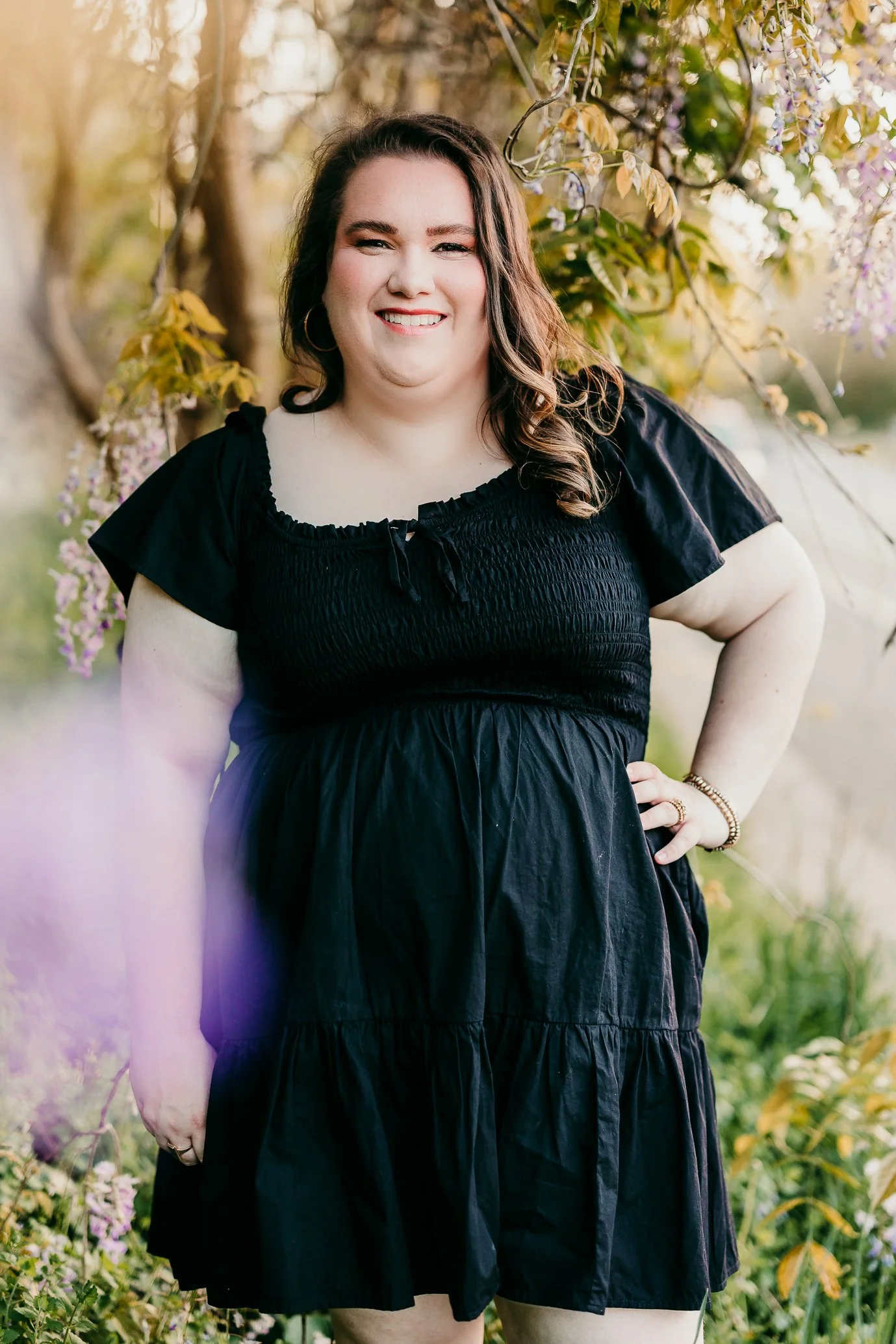 Headshot of Lauren Wilkinson, owner of Wilkinson Creative Co., in downtown Oxford pictured with some wisteria