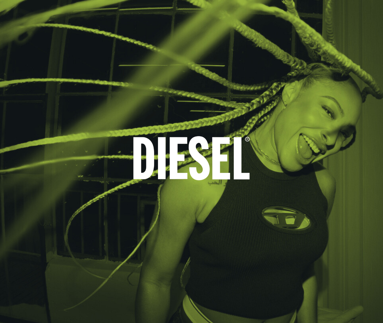 A woman with braided hair laughing and leaning on a metal structure, wearing a black sleeveless top with the Diesel logo, with a green overlay.