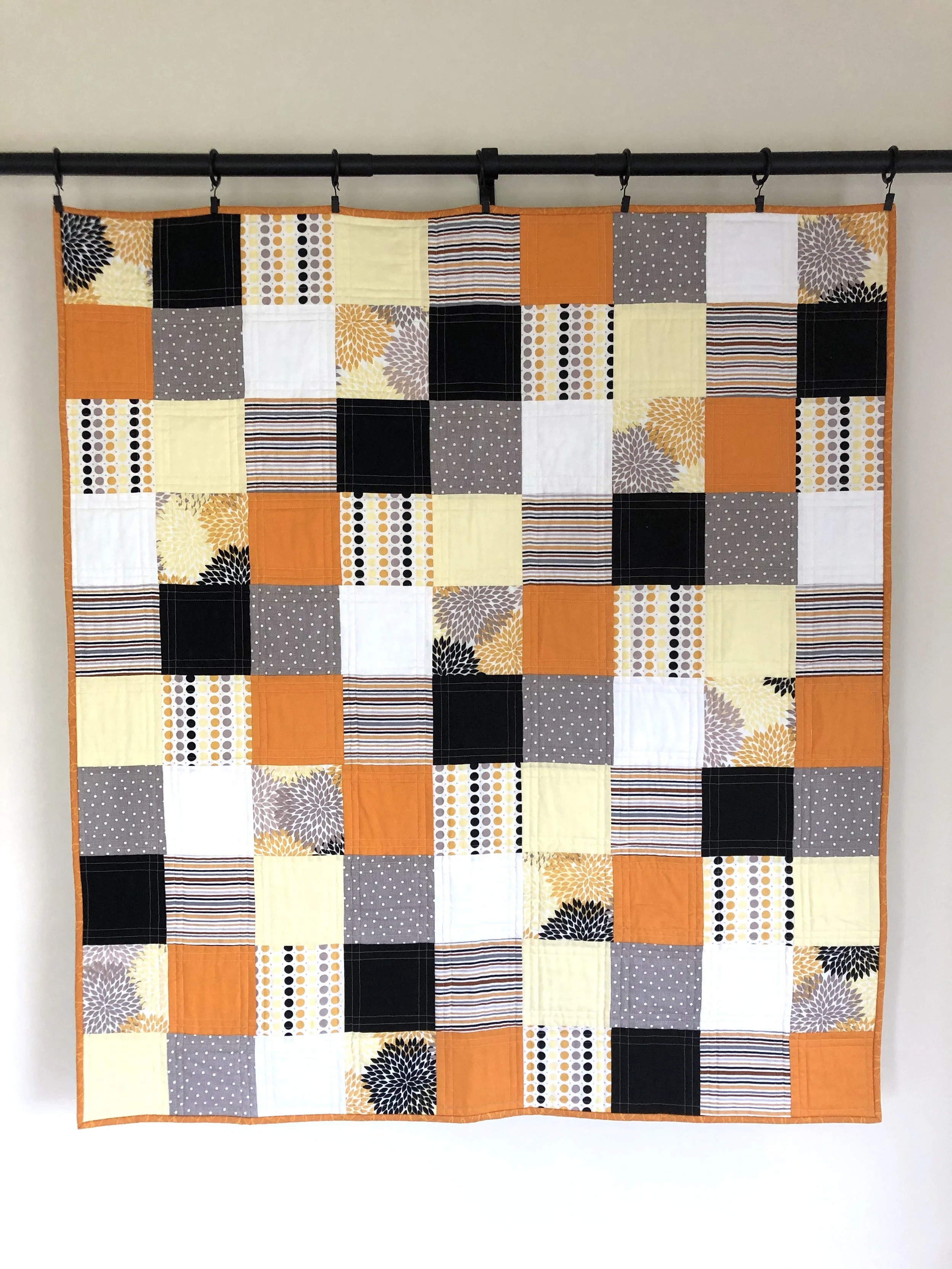 Orange Black Yellow Patchwork Quilt.jpeg
