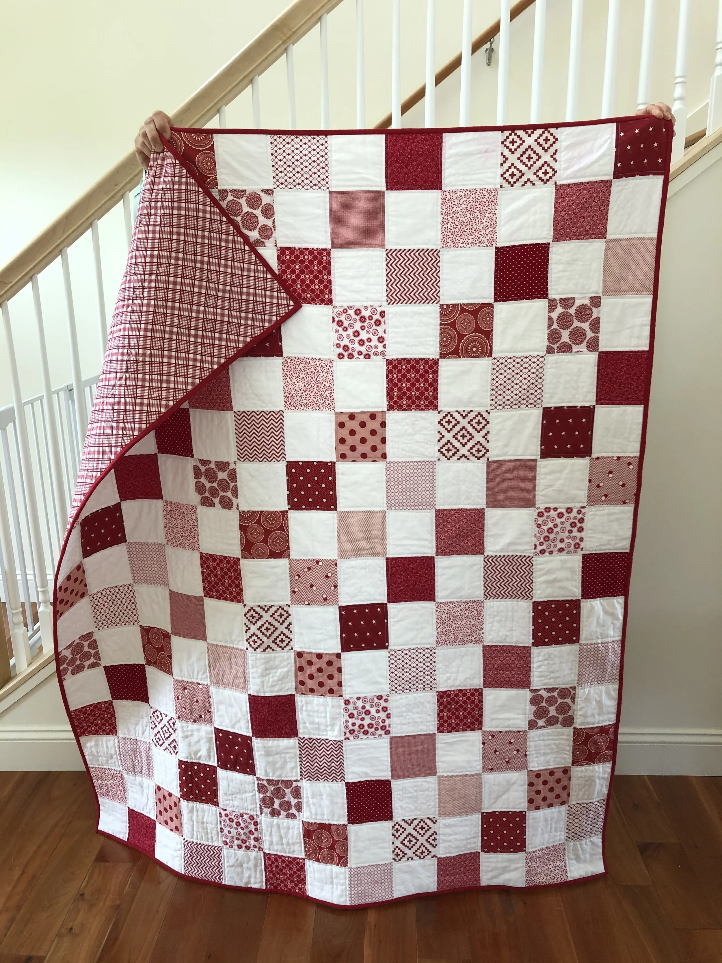 Red White Patchwork Quilt.jpeg