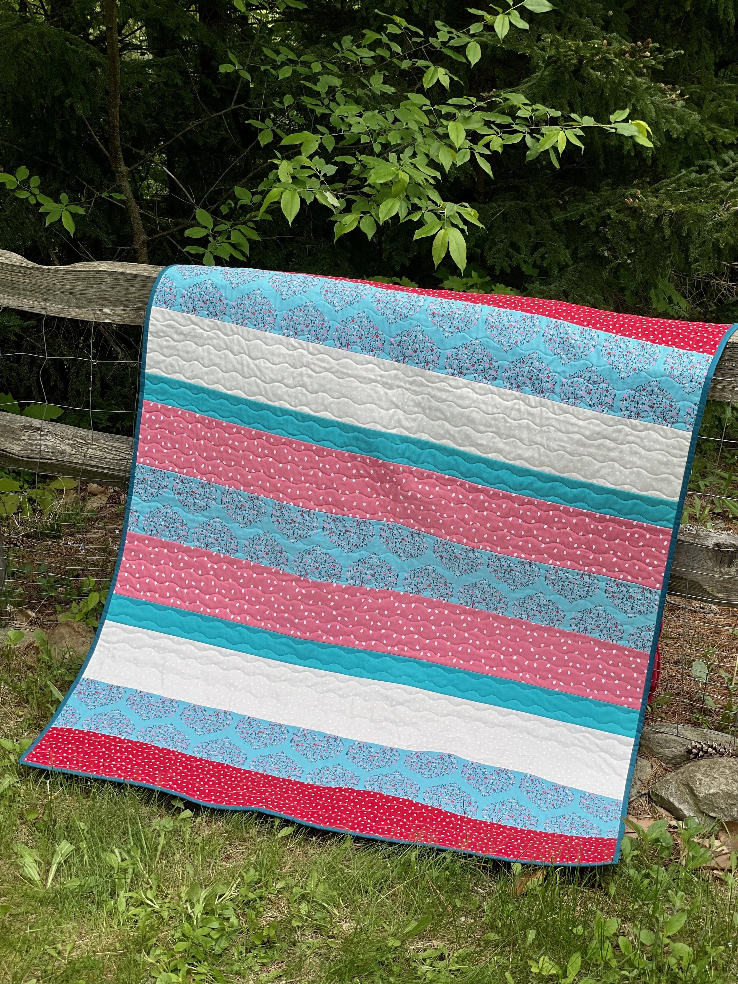 Hearts Pink Blue Red Strip Quilt.jpeg