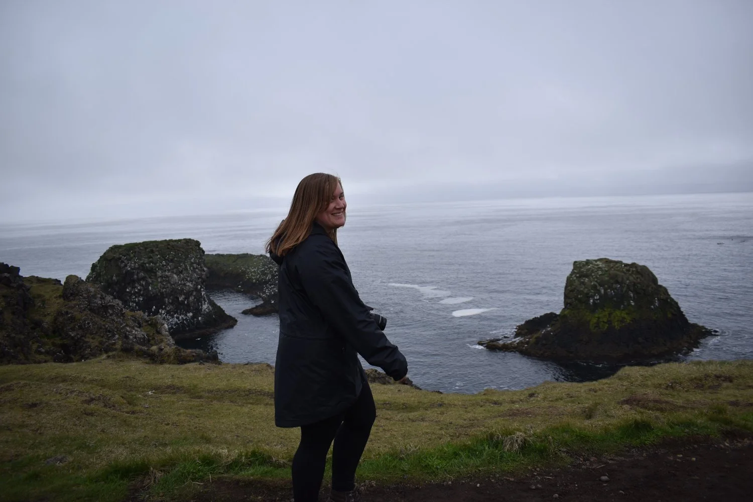 Allison Berryman taking a hike near the ocean in Iceland.