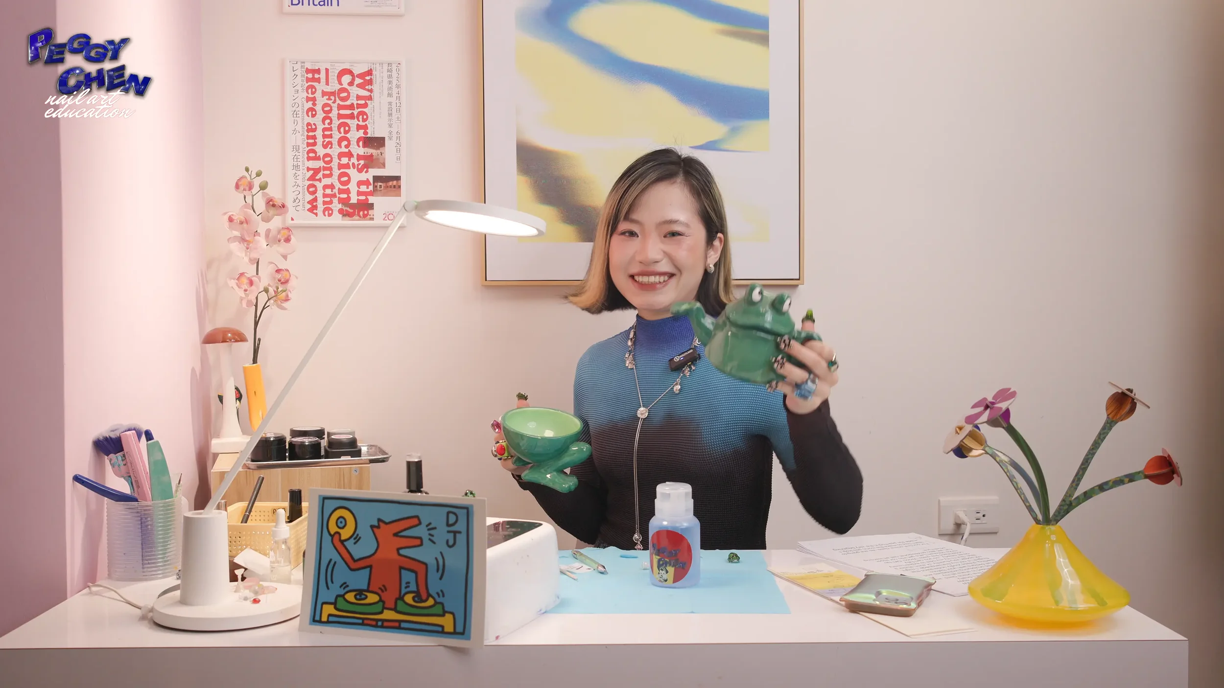 Peggy Chen sitting on Desk and smiling