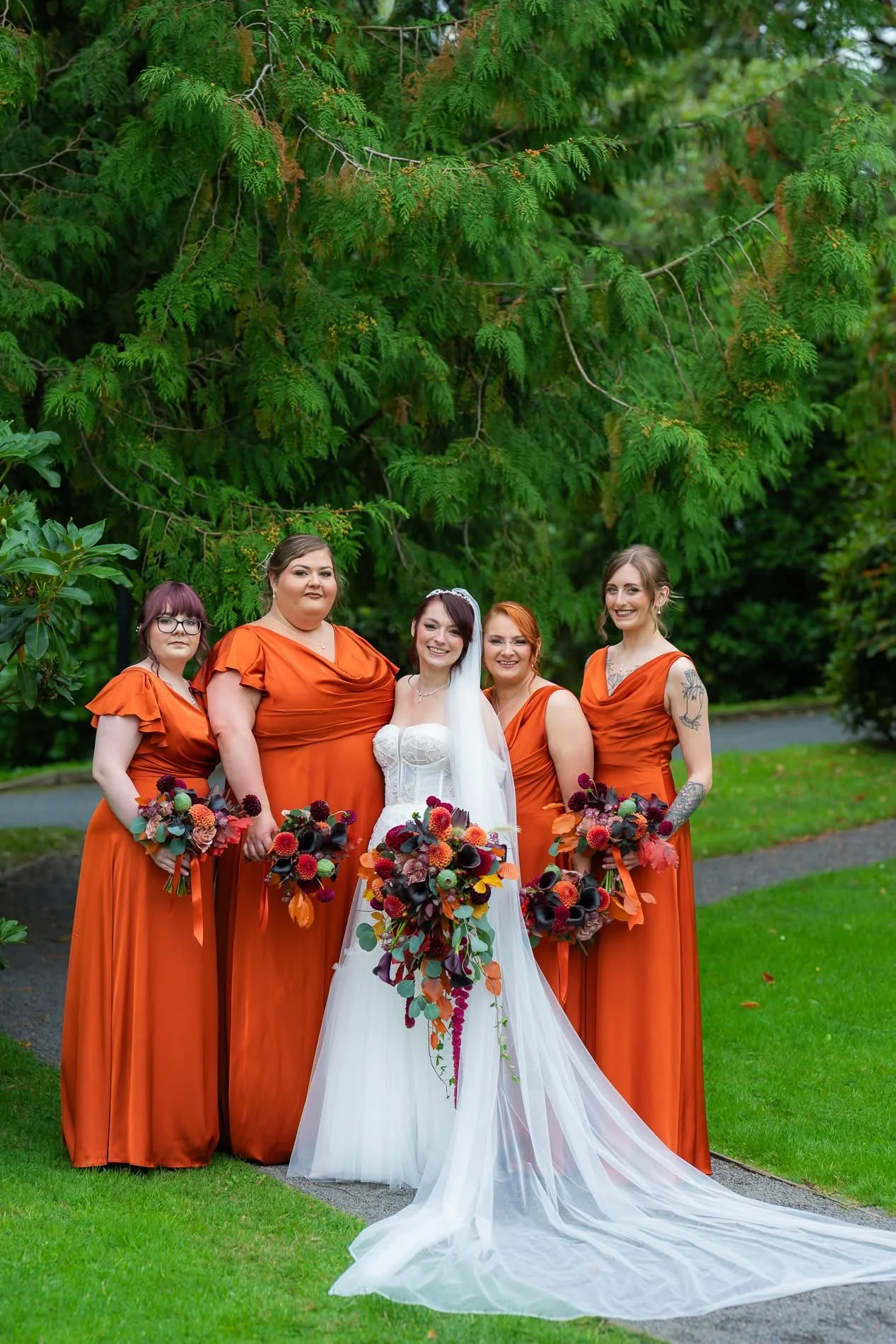 bride holding autumn bridal bouquet with rich moody wedding flowers by wild willow event design wedding florist northern ireland 