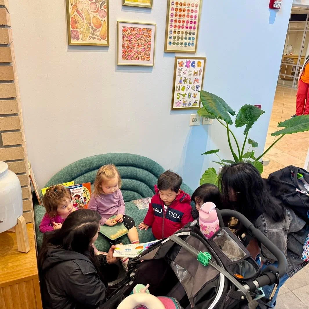 Attending a Stay and Play? 

Bring your kiddos into the cafe to enjoy our &ldquo;cozy corner&rdquo; with a curated selection of multicutural baking books, colorful art, and a low-sitting couch that little legs can hoist up to easily.

We offer small 