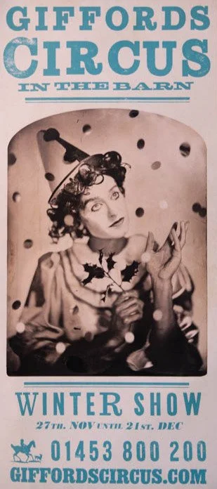 Archive poster for Gifford's Circus Winter Show featuring a black-and-white photo of a woman with curly hair, wearing a vintage outfit, holding a flower and surrounded by falling objects.