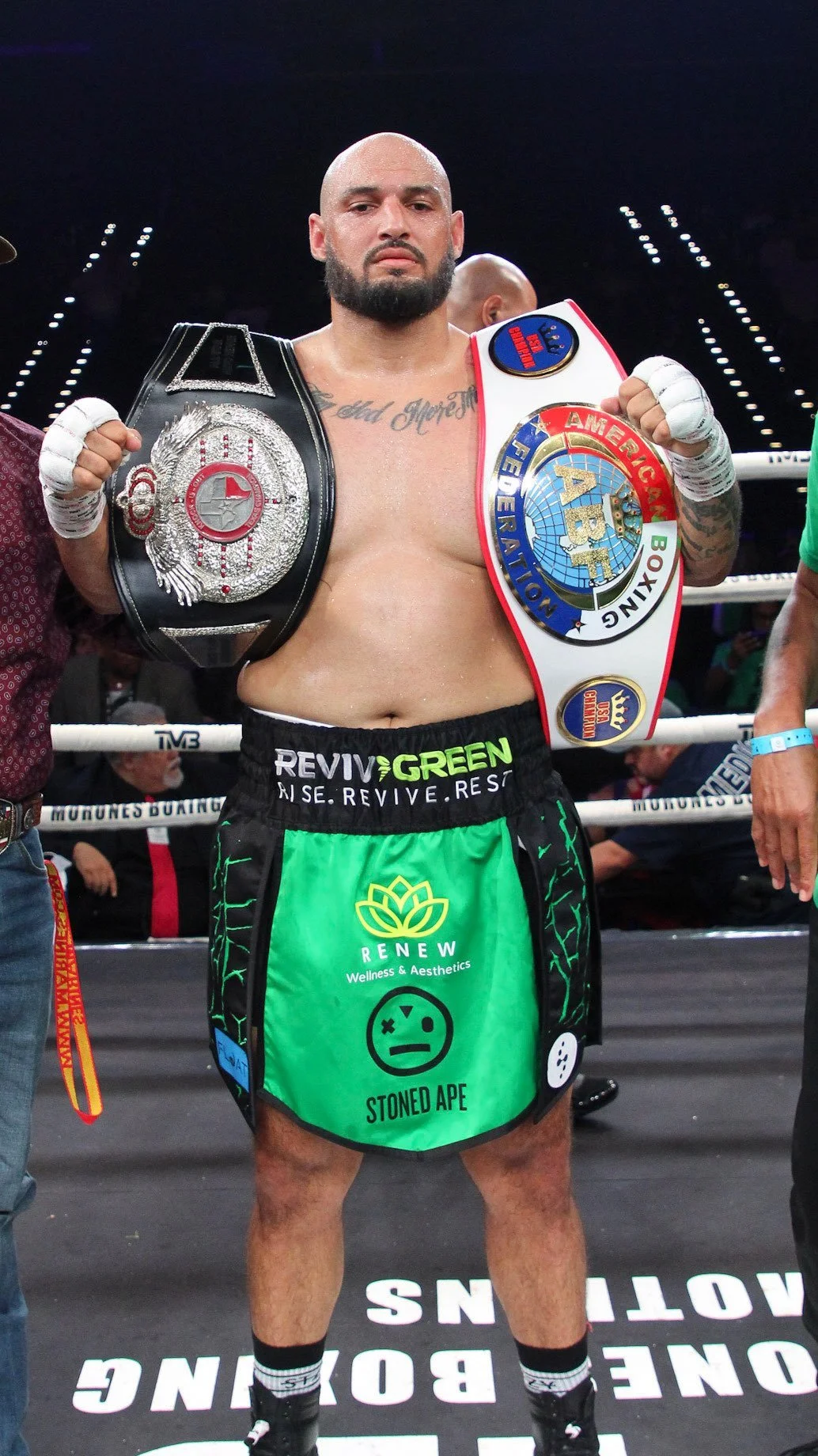 AB with 2 championship belts