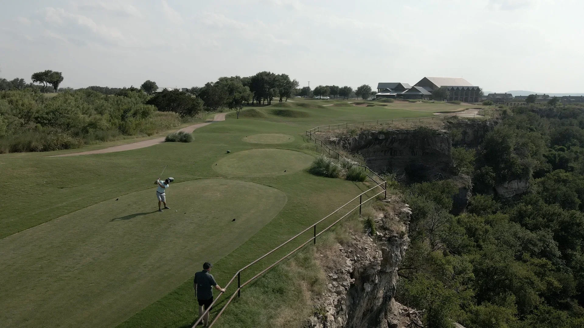 the fairway of a golf course and 2 golfers