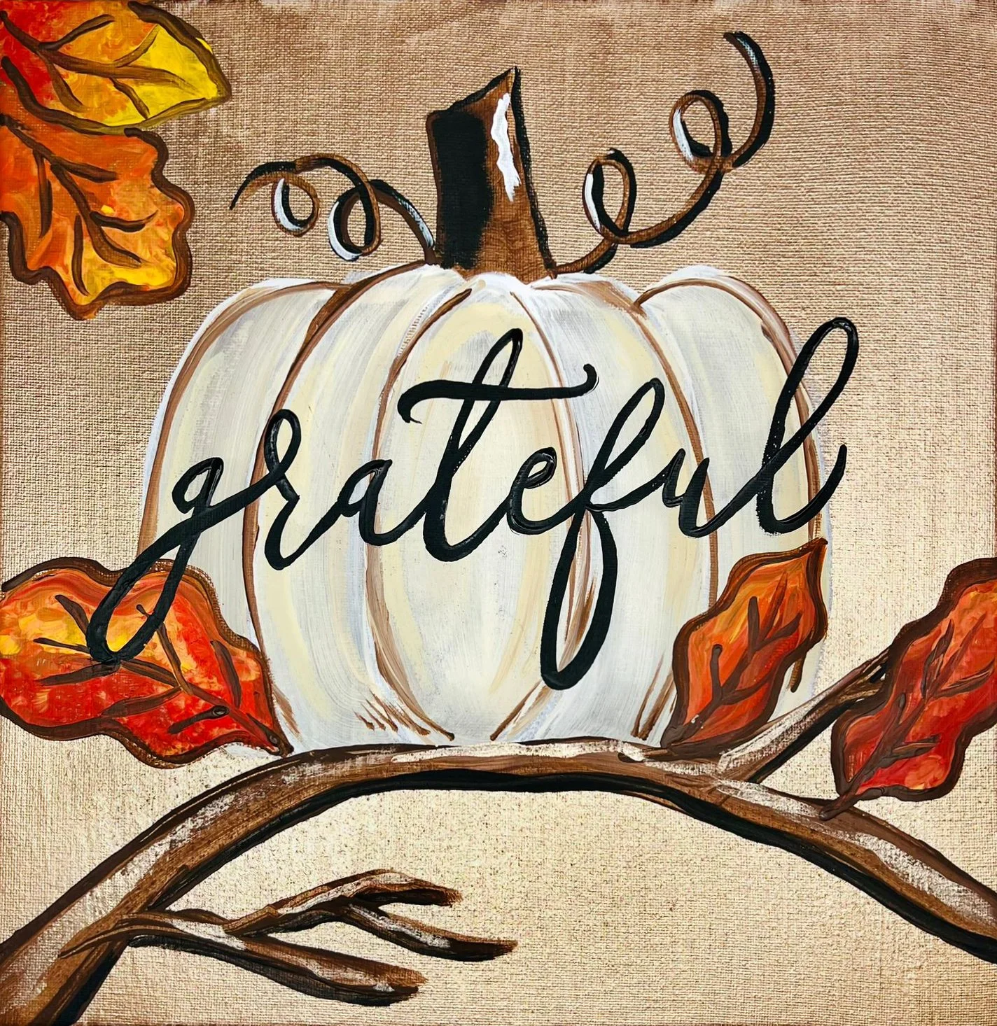 Painting of a white pumpkin with the word 'grateful' written on it in black, surrounded by orange and yellow autumn leaves and brown branches.