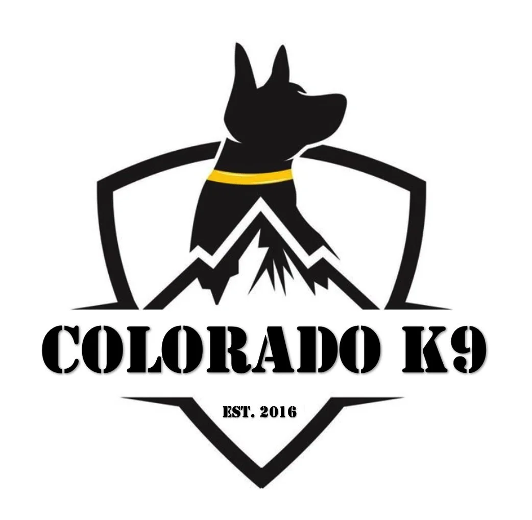 Logo featuring a black dog with a yellow collar, mountains, and a shield outline, with the text "COLORADO K9" and "EST. 2016" underneath.