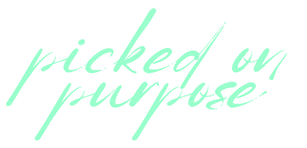 Text that says 'picked on purpose' written in cursive, mint green font on a black background.