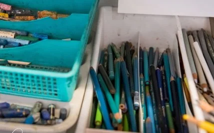 Colored pencils in open bins