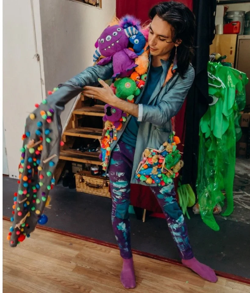 An artist wearing an elaborate art display