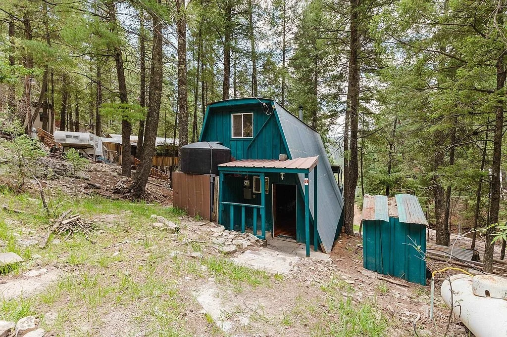 Rustic Mountain A-frame with Fireplace in New Mexico - $155,000