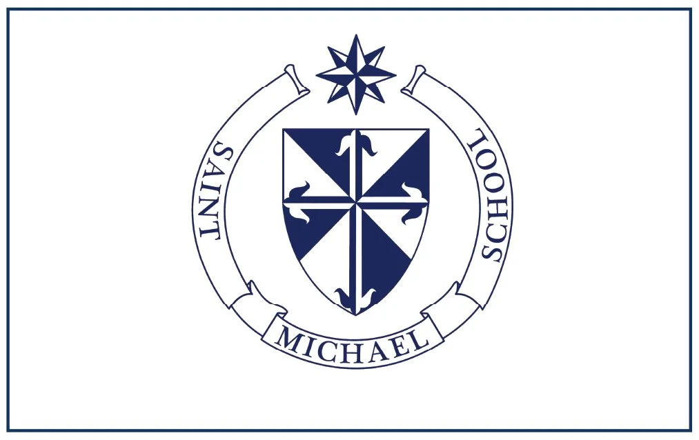 The emblem of Saint Michael School featuring a shield with a cross and four arrows, a star above the shield, and a banner surrounding it with the words 'Saint Michael School'.