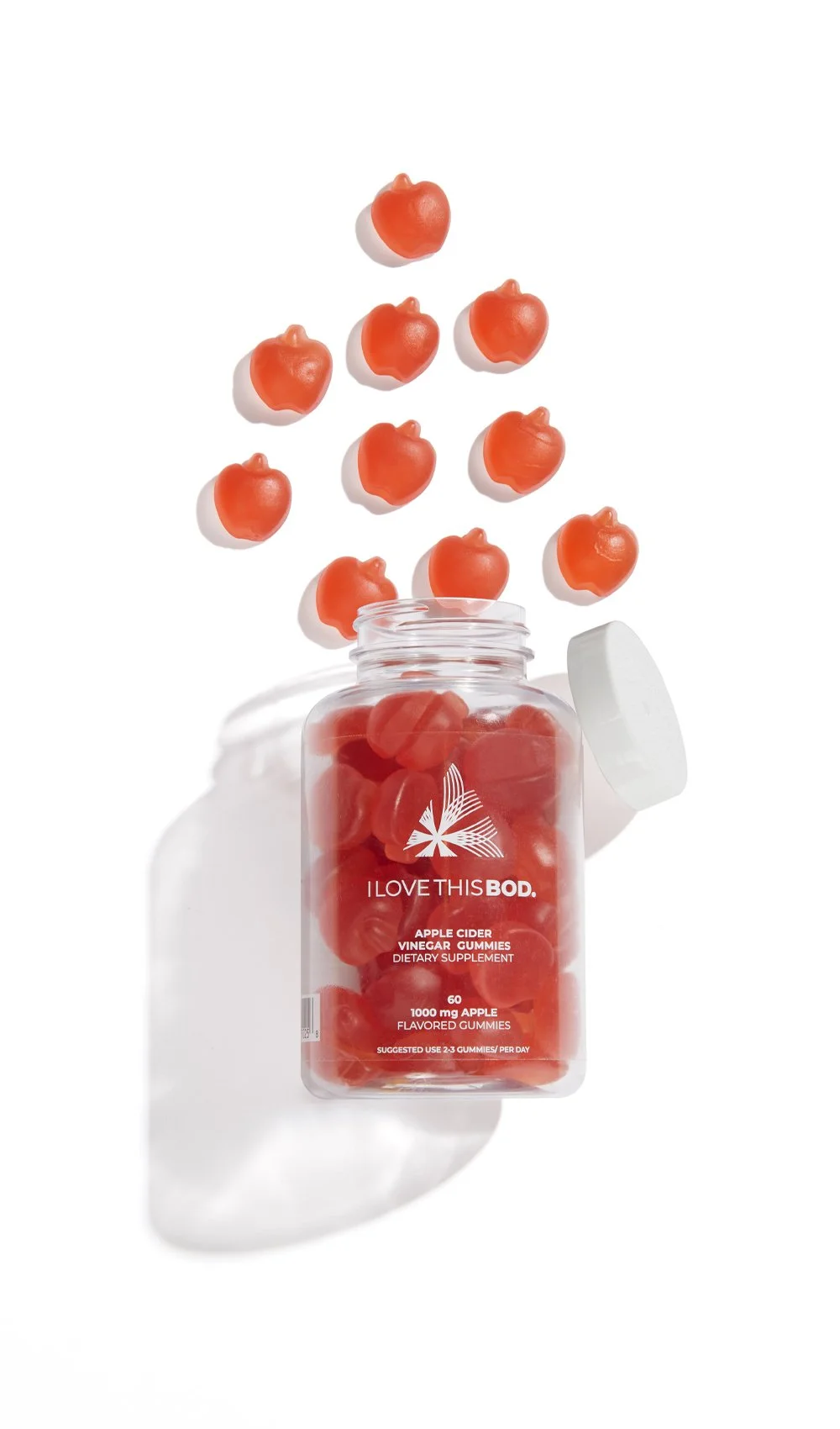 Bottle of apple cider vinegar flavored gummies with gummies falling out of the bottle.