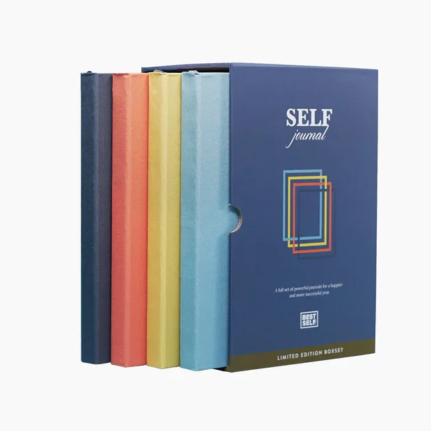 Set of five colorful hardcover journals with a blue self journal box