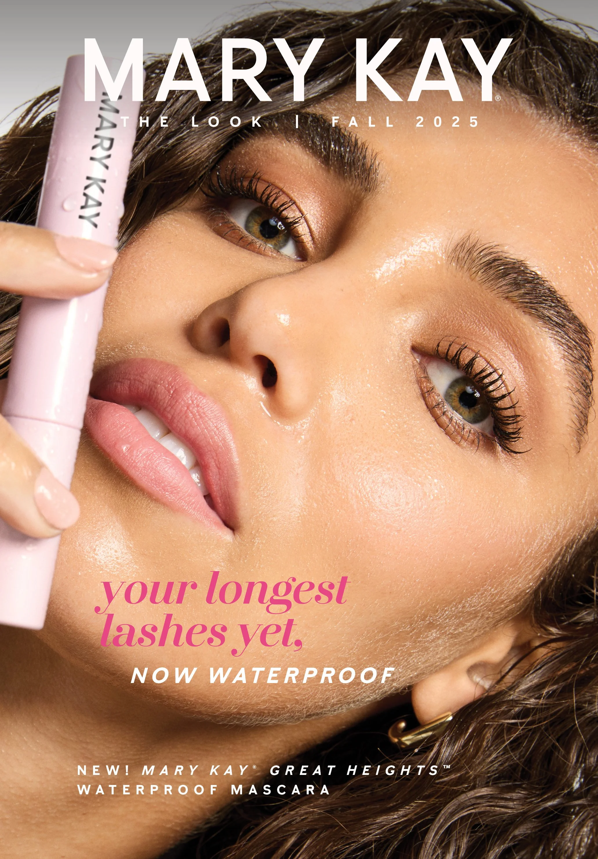 Close-up of a woman with long, waterproof eyelashes holding a pink Mary Kay mascara tube near her face, with bold text promoting the mascara's water resistance and long-lasting lashes for fall 2025.