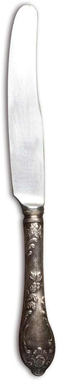 A vintage butter knife with an ornate silver handle and a slightly worn blade.