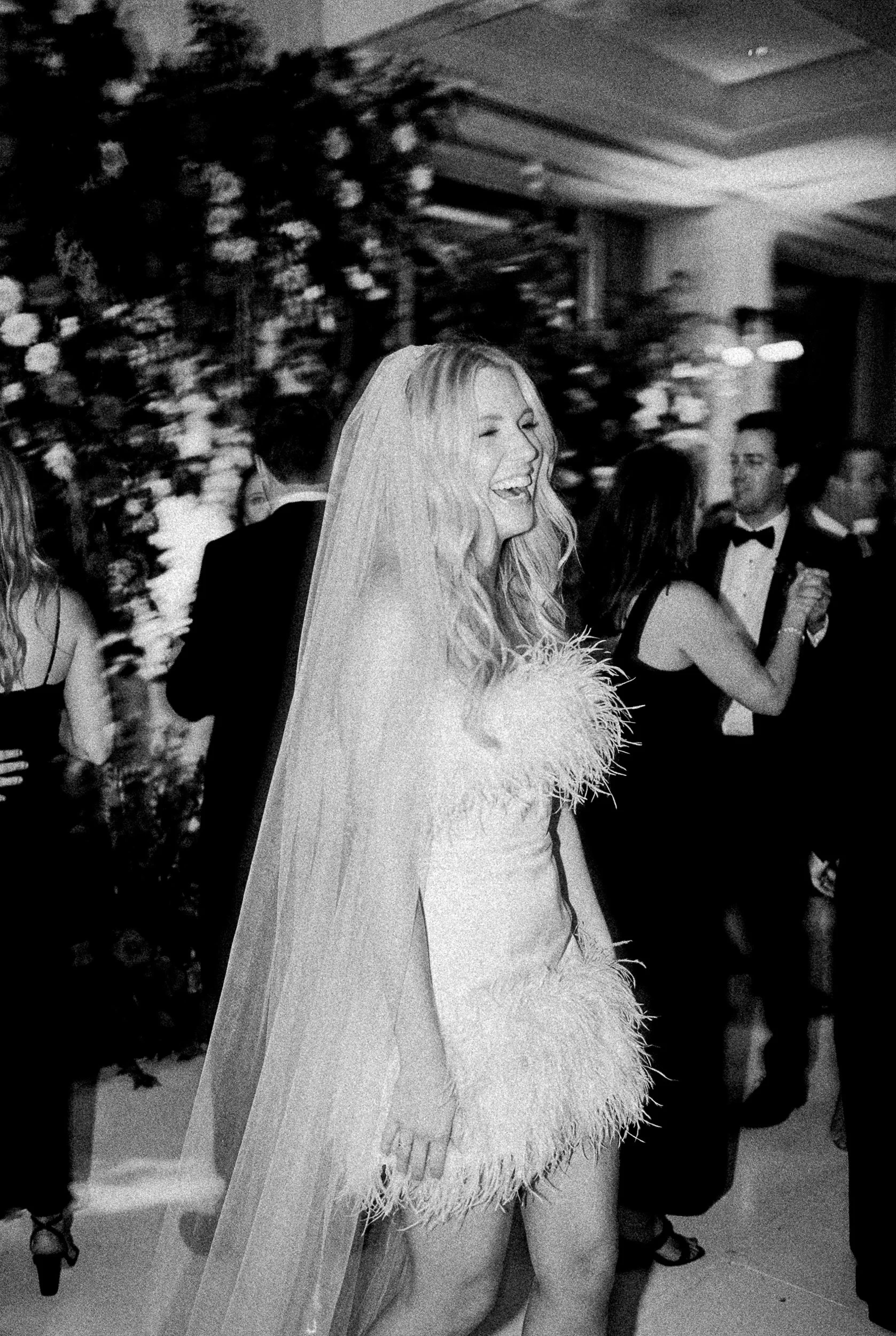 Lumiere and Grain Wedding Photography feather second look bridal dress documentary