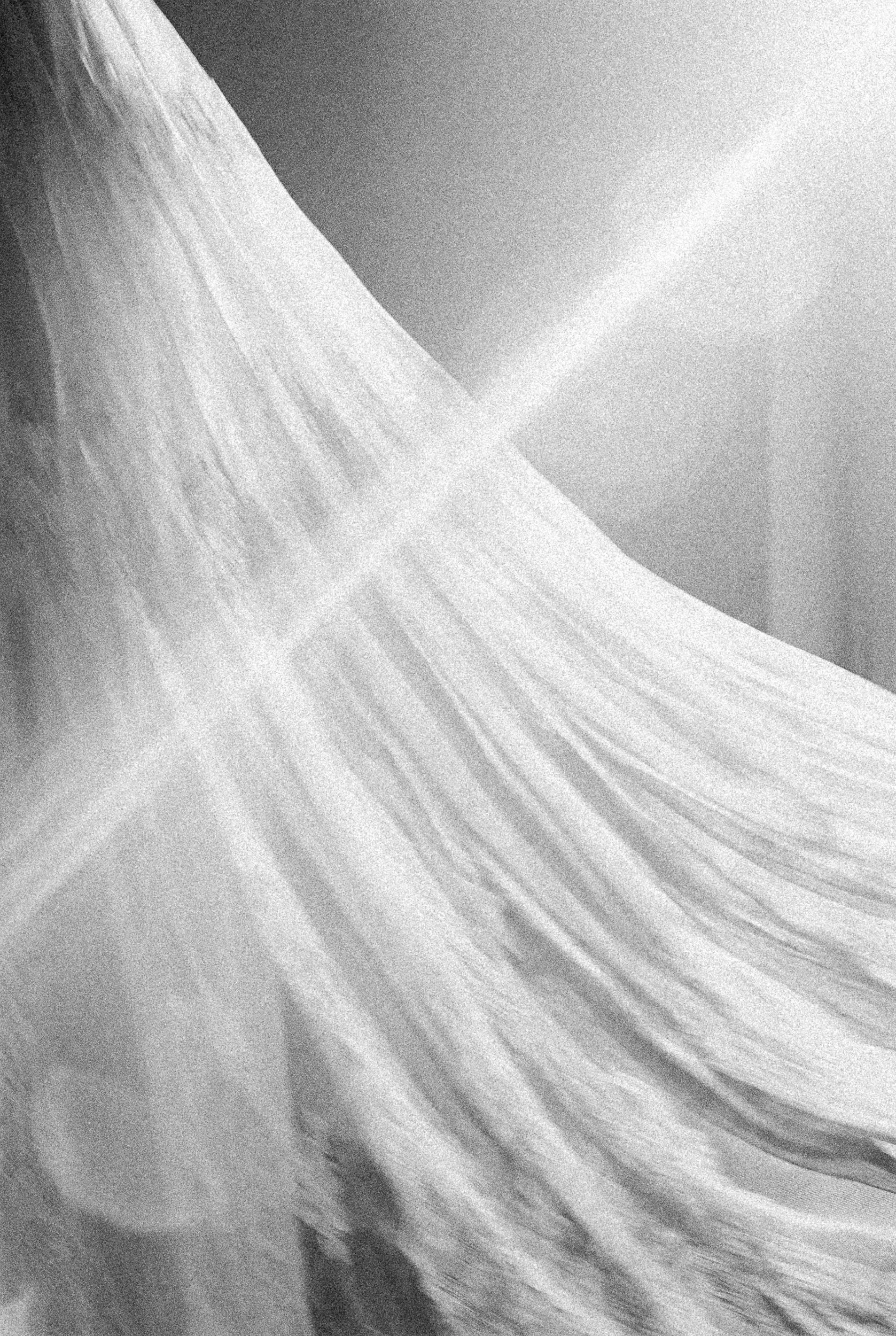 lumiere and grain wedding dress on film with light ray Peninsula Hotel Wedding