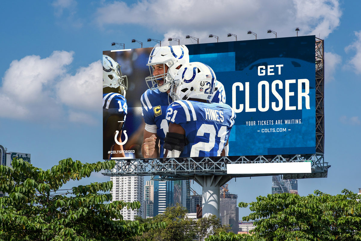 Billboard featuring Indianapolis Colts football players celebrating, with the message "Get Closer" and information about tickets at COLTS.COM.