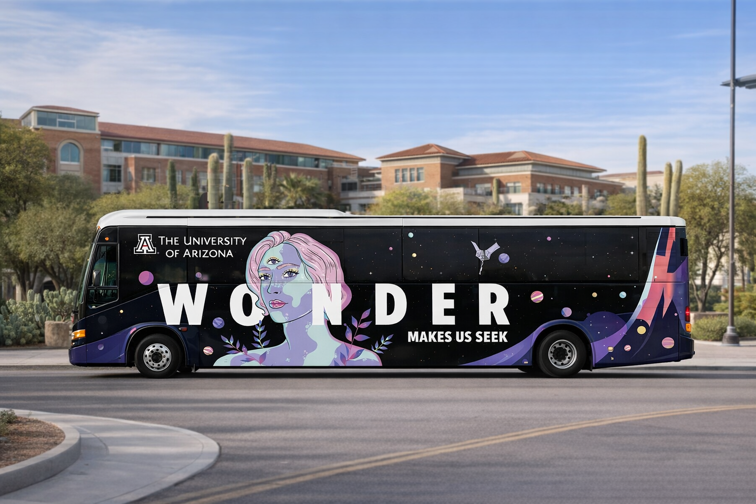 A bus with a graphic design featuring an illustrated woman with pink hair and cosmic elements, promoting the University of Arizona's theme "Wonder makes us seek".