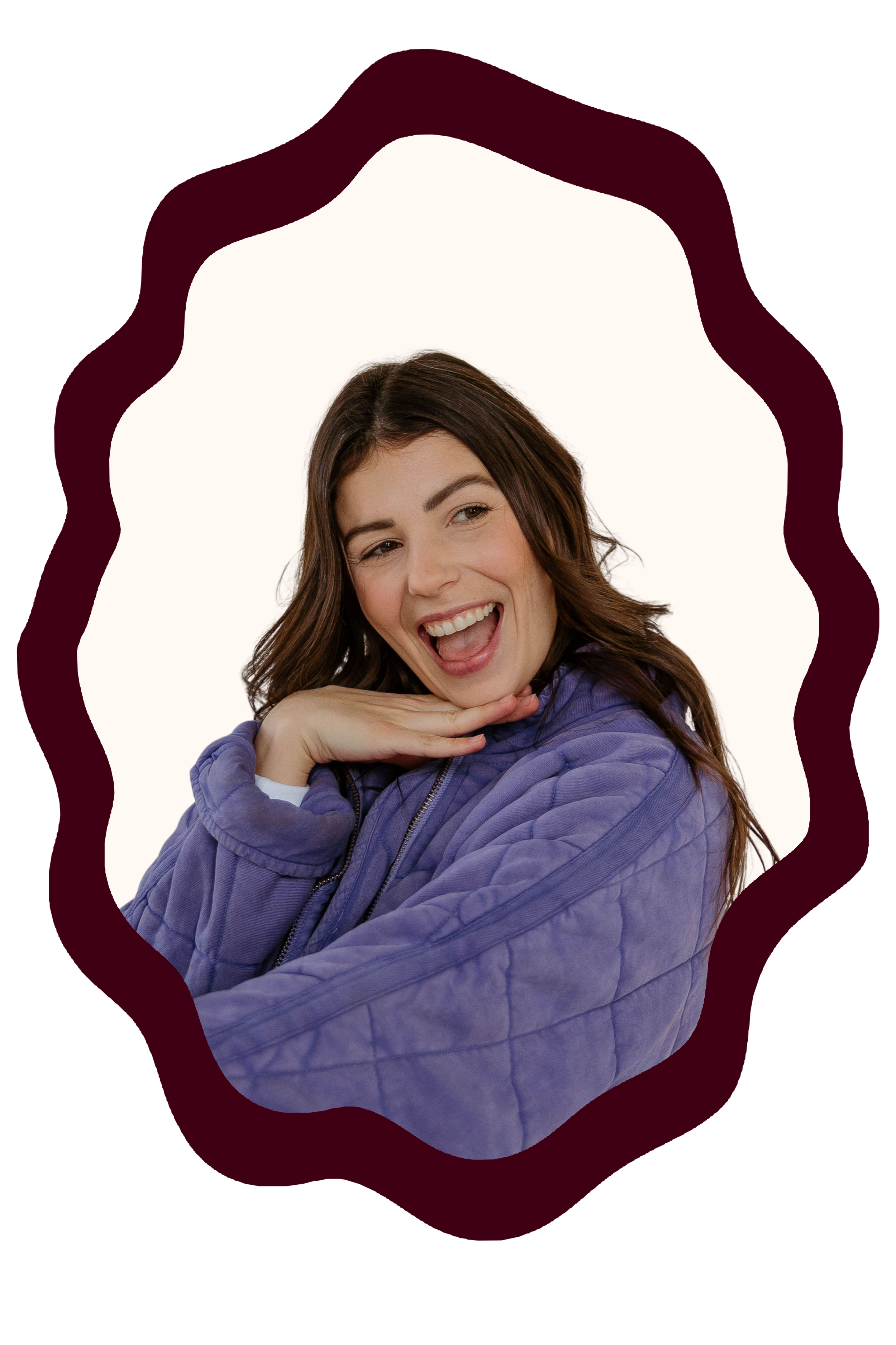 Kristen Ontiveros with brown hair makes a playful expression, resting her chin on her hand, wearing a purple puffy jacket, with a white background and a wavy dark frame around her.